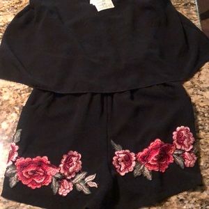 Black Romper with Flower Detailing